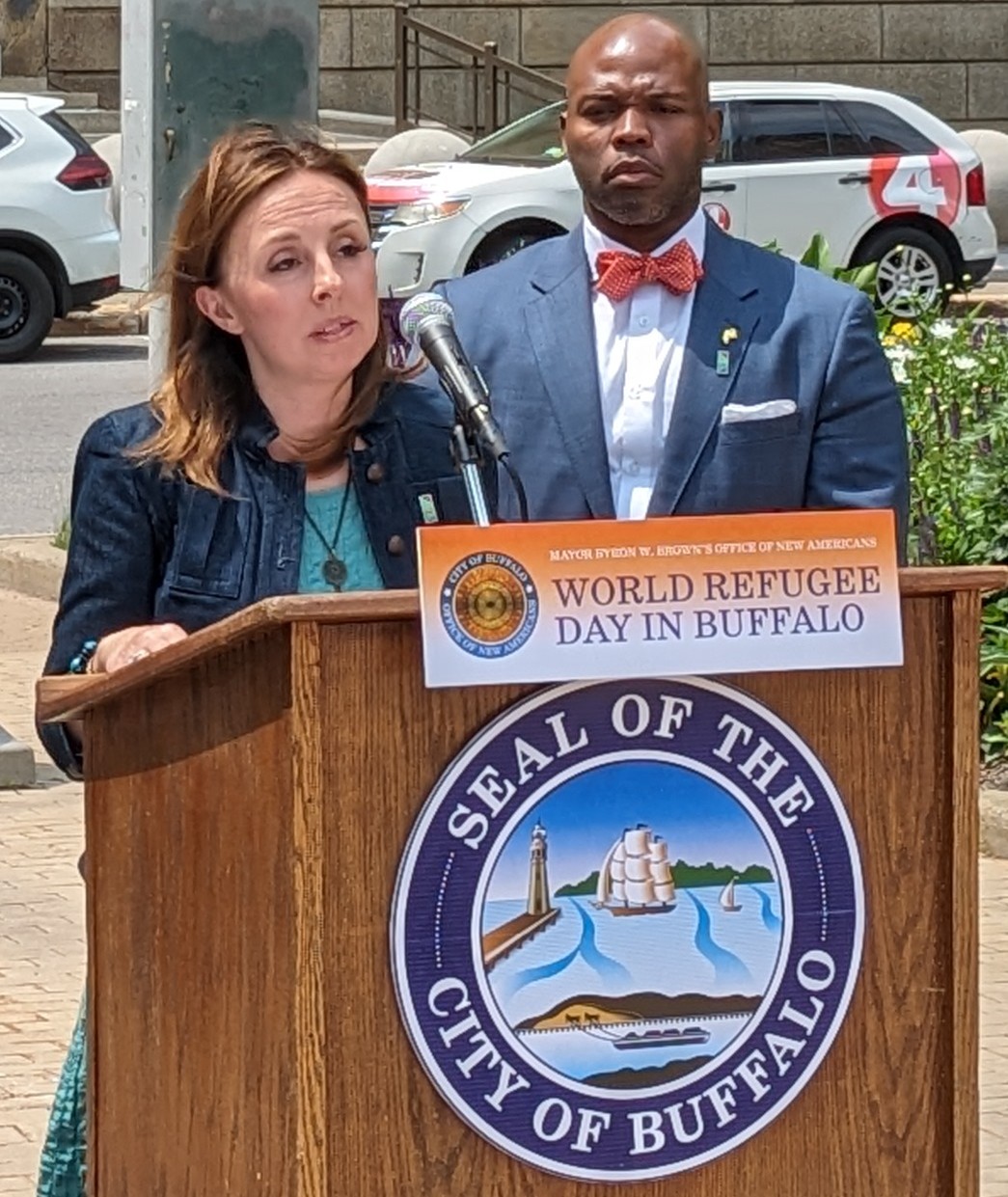 Executive Director Jennifer Rizzo-Choi Speaking with Buffalo Mayor Byron Brown and other City Officials to Commemorate World Refugee Day